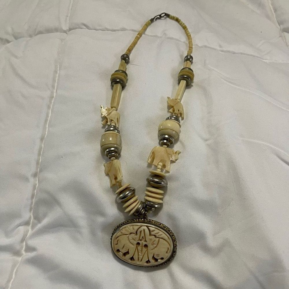 Vintage carved bone elephant medallion necklace